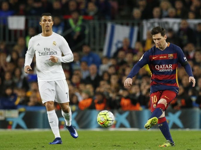 Football Soccer - FC Barcelona v Real Madrid - La Liga - Camp Nou, Barcelona - 2/4/16 Barcelona's Lionel Messi in action with Real Madrid's Cristiano Ronaldo Reuters / Albert Gea Livepic EDITORIAL USE ONLY.