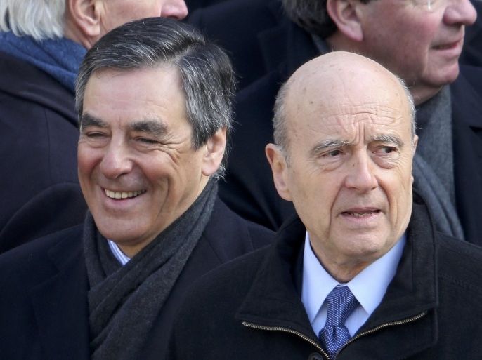 File photo shows former French prime ministers Francois Fillon (L) and Alain Juppe (R) as they attended an official funeral ceremony at the Hotel des Invalides in Paris, France, in this picture taken March 8, 2016. Alain Juppe and Francois Fillon are the top two candidates after results in voting November 20, 2016 in the French center-right presidential primary election. Picture taken March 8, 2016. REUTERS/Charles Platiau/File Photo