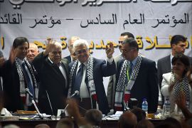 epa01818795 Fatah members applaud Palestinian President Mahmoud Abbas (C-R) as he waves during THE Fatah congress in the West Bank town of Bethlehem 08 August 2009. Abbas was re-elected 08 August to lead Fatah by consensus at his party's first conference in two decades, strengthening the hand of the Western-backed leader to revive peace talks with Israel. EPA/ABED AL HASHLAMOUN
