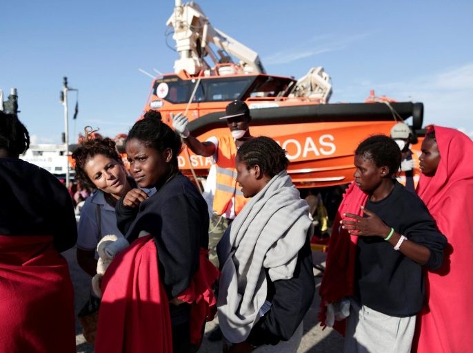 Migrants disembark from the rescue vessel Responder, a rescue boat run by the Malta-based NGO Migrant Offshore Aid Station (MOAS) and the Italian Red Cross (CRI), in the Italian harbour of Vibo Marina, Italy, October 22, 2016. Yara Nardi/Italian Red Cross press office/Handout via Reuters ATTENTION EDITORS - THIS IMAGE WAS PROVIDED BY A THIRD PARTY. EDITORIAL USE ONLY.
