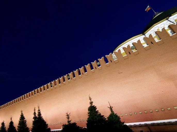 A general view shows the Spasskaya Tower and the Kremlin wall in central Moscow, Russia, May 5, 2016. To match Insight RUSSIA-POLITICS/ REUTERS/Sergei Karpukhin/File Photo