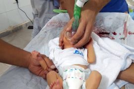 A handout picture made available by the Syria Civil Defense Idlib branch shows a rescue worker giving treatment to a baby who was allegedly affected by a chlorine gas canister attack dropped by an unidentified military helicopter, in Saraqeb, Idlib, Northern Syria, 02 August 2016. According to the Syria Civil Defense volunteer group, at least 30 Syrians were affected by a Chlorine gas attack. Chlorine gas use as a weapon is banned by the Chemical Weapons convention. The
