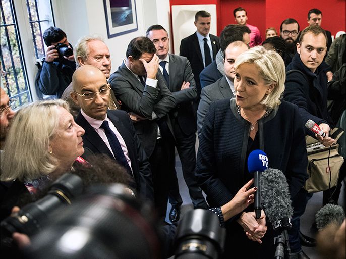 epa05633479 French far right party leader Marine Le Pen (C) answers media questions after she launched her campaign for the French presidential elections of 2017 in Paris, France, 16 November 2016. EPA/ETIENNE LAURENT
