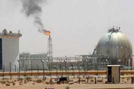 A gas flame is seen in the desert near the Khurais oilfield, Saudi Arabia June 23, 2008. REUTERS/Ali Jarekji/File Photo