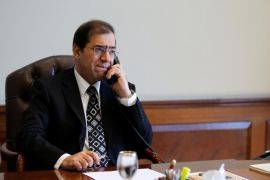 Tarek El Molla, Egypt's Minister of Petroleum and Mineral Resources, speaks on the telephone during an interview with Reuters at his office in Cairo, Egypt, October 29, 2015. Picture taken October 29, 2015. REUTERS/Amr Abdallah Dalsh