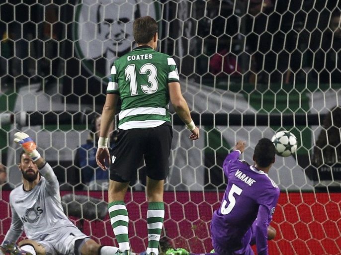 Football Soccer - Sporting Portugal v Real Madrid - UEFA Champions League group stage Group F - Jose Alvalade stadium, Lisbon, Portugal - 22/11/16 Real Madrid's Raphael Varane scores their first goal. REUTERS/Pedro Nunes EDITORIAL USE ONLY. NO RESALES. NO ARCHIVE.