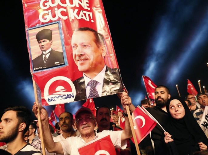 Demonstrators hold pictures of Turkish President Recep Tayyip Erdogan and Ataturk, founder of modern Turkey, at Bosphorus Bridge during a demonstration against coup in Istanbul, Turkey, 21 July 2016. Turkish President Recep Tayyip Erdogan on 20 July declared a three-month state of emergency and caused the dismissal of 50,000 workers and the arrest of 8,000 people after the 15 July failed coup attempt. At least 290 people were killed and almost 1,500 injured amid violent clashes on 15 July as certain military factions attempted to stage a coup d'etat. The UN and various governments and organizations have urged Turkey to uphold the rule of law and to defend human rights.