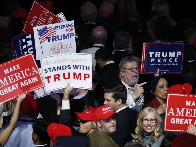 People in the crowd at Donald Trump's 2016 US presidential Election Night event watch results continue to come in at the New York Hilton Midtown in New York, New York, USA, 08 November 2016. Americans vote on Election Day to choose the 45th President of the United States of America to serve from 2017 through 2020.
