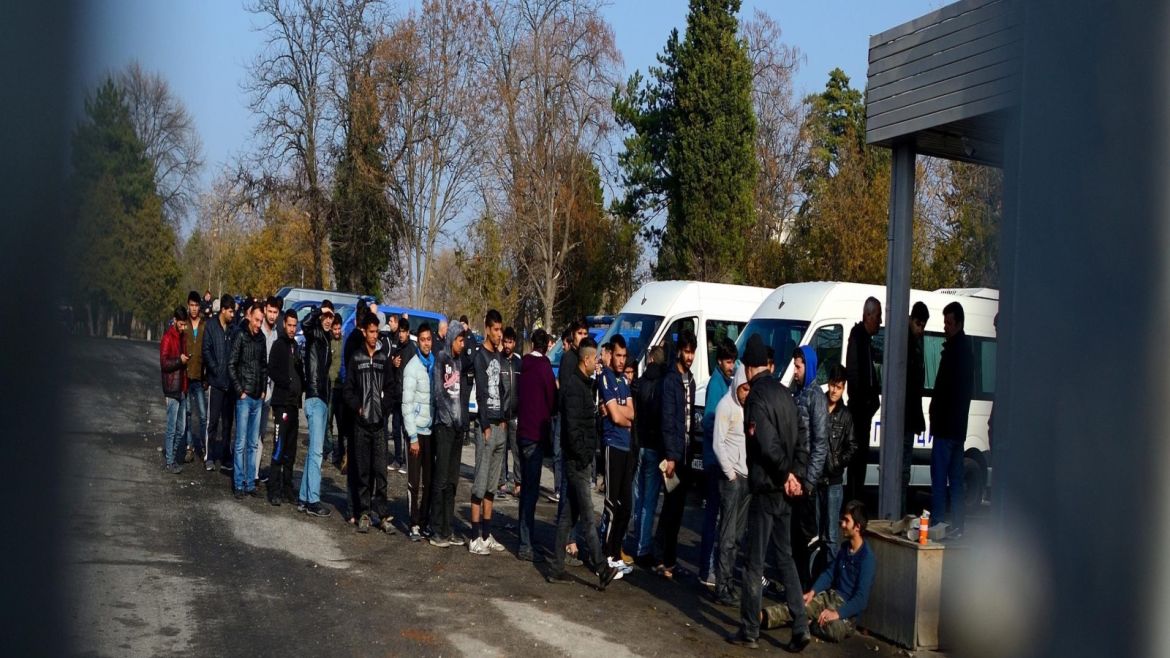 Refugees wait in line in order to receive food at the migrant camp in the town of Harmanly, some 250 km from Sofia, Bulgaria, 25 November 2016. According to media reports citing Prime Minister Boyko Borissov, around 300 migrants, six of them considered a threat to national security, have been arrested following violence at the camp. Around 1,500 migrants had rioted in Bulgaria's largest refugee camp, triggering clashes that left two dozen police injured and prompted th