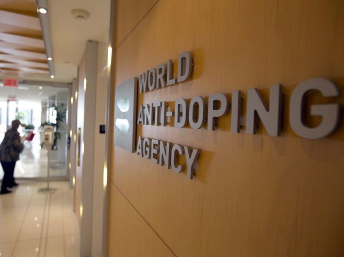 A woman walks into the head office of the World Anti-Doping Agency (WADA) in Montreal, Quebec, Canada November 9, 2015. REUTERS/Christinne Muschi/File Photo