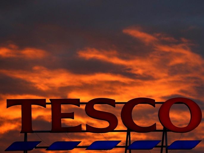 A company logo is pictured outside a Tesco supermarket in Altrincham northern England, April 16, 2016. REUTERS/Phil Noble/File Photo GLOBAL BUSINESS WEEK AHEAD PACKAGE Ð SEARCH ÒBUSINESS WEEK AHEAD 3 OCTÓ FOR ALL IMAGES