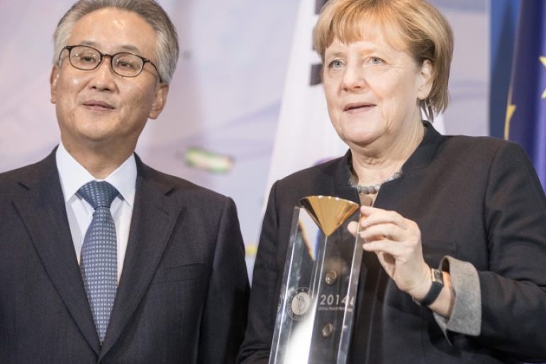 German Chancellor Angela Merkel (R) receives the Seoul Peace Prize from the General Secretary of the Seoul Peace Foundation Kim Seung-Chae (L) for her work in peace-making and against terrorism in Berlin, Germany, 02 November 2016. The Seoul Peace Prize was founded by the South Korean government in 1990. It is awarded every two years.