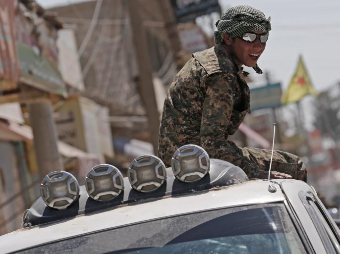 (FILE) A file photograph dated 23 June 2015 showing a member of Kurdish People Defence Units (YPG) sitting on a truck after coming from the Syrian town of al-Raqqa, in Tel Abyad, Syria. Reports state the Syrian Democratic Forces (SDF) announced on 06 November 2016 that it had started a military campaign to liberate the northern Syrian city of Raqqa, the main stronghold of the Islamic State militant group in Syria. SDF is an umbrella group gathering Kurdish and Arab rebels fighting in Syria.