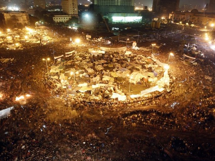RNPS IMAGES OF THE YEAR 2011 - Anti-government protesters celebrate inside Tahrir Square after the announcement that Egyptian President Hosni Mubarak resigned, in Cairo February 11, 2011.