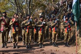 Pakistani Army soldiers attend a funeral ceremony of their comrade Havaldar Ibrar Ahmad Awan, who was killed during clashes across the Line of Control, the defacto border between Pakistani and Indian administered Kashmir, during his funeral in Palhot village Jehlum valley near Muzaffarabad, Pakistan, 15 November 2016. According to media reports seven Pakistani army soldiers were killed in shelling by Indian army in the Bhimber sector of the line of control on 14 November.