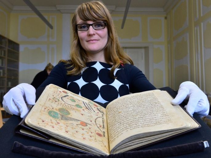 Mareike Beetz, academic assistant with the oriental manuscript collection, presents the Arabic manuscript 'al-Masalik wa al-mamalik' by Islamic scholar al Istakhri in the research library at Friedenstein Castle in Gotha, Germany, 14 October 105. The work is considered one of the best known geography books from the 10th century. A.D. UNESCO has added two texts - including the Arabic manuscript - from the Gotha research library to their world documentary heritage list within the context of the 'Memory of the World' program.