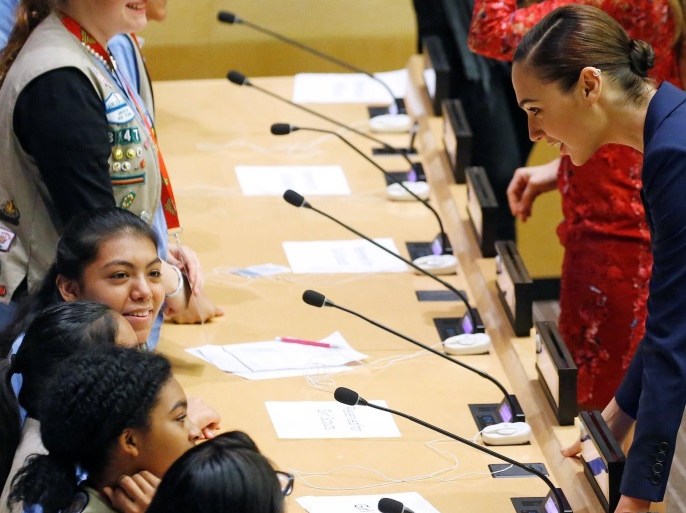 Actor Gal Gadot speaks with children during an event to name Wonder Woman UN Honorary Ambassador for the Empowerment of Women and Girls at the United Nations Headquarters in the Manhattan borough of New York, New York, U.S., October 21, 2016. REUTERS/Carlo Allegri