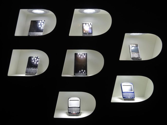 (FILE) A file photo dated 16 March 2016 showing small compartments containing Blackberry mobile phones built together to resemble a Blackberry logo at the CeBIT computer trade show in Hanover, Germany. Blackberry on 01 April 2016 reported losses but still better than expected fourth quarter 2015 results. Blackberry reported a quarterly revenue of 487 million USD, while analysts had expected 563 million USD.