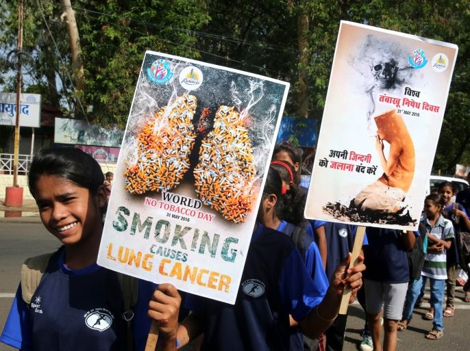 epa05338251 Indian children hold placards during an awareness rally on the occasion of World No Tobacco Day in Bhopal, India, 31 May 2016. The World Health Organization endorses new plain packaging for tobacco products to raise awareness of the health risks of tobacco smoking, according to media reports. World No Tobacco Day is marked annually on 31 May to raise awareness of the health risks of tobacco use and to push advocacy for policies to reduce tobacco consumption.