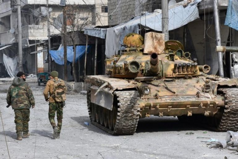 A handout photograph released by the official Syrian Arab News Agency (SANA) on 13 December 2016 showing Syrian soldiers walking next to a tank after government forces took control over the neighborhood in Aleppo, Syria, 12 December 2016. Media reports state the Syrian army on 12 December claimed it had recaptured 98 percent of former rebel territory in eastern Aleppo. The huge regime gains come as part of the military offensive launched by forces loyal to President Bashar Assad on 15 November. Since then, over 1,000 people have been killed in the northern Syrian city. EPA/SANA HANDOUT
