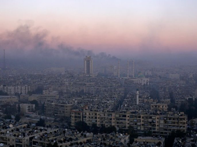 Smoke rises near the Old City of Aleppo as seen from a government controlled area of the city, Syria December 8, 2016. REUTERS/Omar Sanadiki