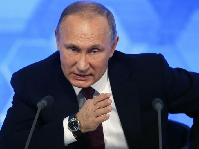 Russian President Vladimir Putin gestures while answering a question during his annual press conference in International Trade Center in Moscow, Russia, 23 December 2016. A total of 1,437 journalist from all regions of Russia are accredited at the press conference with many of them using various creative ways to attract the attention of the Russian leader and to ask their questions.