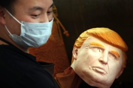 A picture made available on 27 May 2016 shows a man working on latex masks of US presidential candidate Donald Trump at a factory in Pujiang county, in east China's Zhejiang province, China, 18 May 2016. The orders for the masks of Donald Trump and Hilary Clinton both exceed 500,000 pieces from the factory, expected to arrive on US soil soon. EPA/GE YUEJIN CHINA OUT