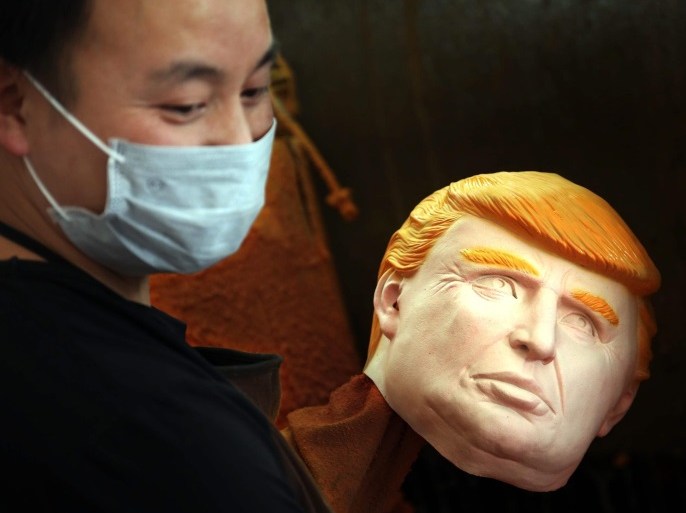 A picture made available on 27 May 2016 shows a man working on latex masks of US presidential candidate Donald Trump at a factory in Pujiang county, in east China's Zhejiang province, China, 18 May 2016. The orders for the masks of Donald Trump and Hilary Clinton both exceed 500,000 pieces from the factory, expected to arrive on US soil soon. EPA/GE YUEJIN CHINA OUT