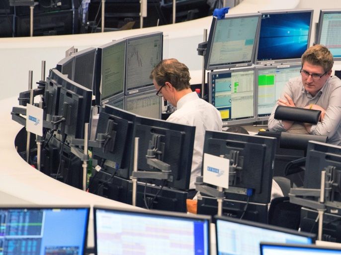 Stock traders check data on several screens at the stock exchange in Frankfurt, Germany, 05 December 2016. Germany's main stock index DAX rose of more than 200 points, or 1.6 per cent, to a 10.682 point level in midday trading. Traders were quoted by German business newspapers as saying that investors are now clearing their tense security aquisitions following the Italian Prime Minister Matteo Renzi's referendum defeat on 04 December.