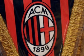 The AC Milan logo is pictured on a pennant in a soccer store in downtown Milan, Italy April 29, 2015. REUTERS/Stefano Rellandini/File Photo