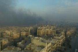 A still image from video taken December 12, 2016 of a general view of smoke rising over bomb damaged eastern Aleppo, Syria. Video released December 12, 2016. REUTERS/via ReutersTV