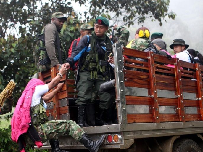 FARC guerrilla members travel to the Christmas celebrations, in the Alfonso Cano Block camp at the mountains of the Cauca Department, southwest of Colombia, on 24 December 2016. After 52 years of armed conflict with the Colombian State, this is the last Christmas of FARC as an armed rebel group.