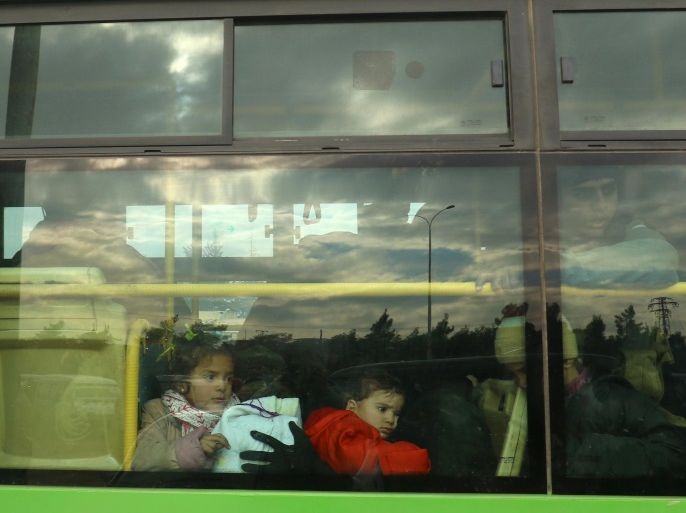 Evacuees from rebel-held eastern Aleppo arrive by bus to an area on the western edge of Aleppo city which is held by insurgents, in Syria December 16, 2016. REUTERS/Ammar Abdullah