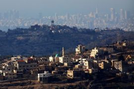 A general view of two Palestinian villages in the front and Israeli City of Tel Aviv in the background, near the west bank city of Ramallah, 10 December 2016.