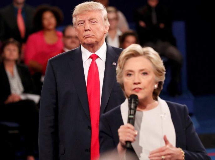 FILE PHOTO - Republican U.S. presidential nominee Donald Trump listens as Democratic nominee Hillary Clinton answers a question from the audience during their presidential town hall debate at Washington University in St. Louis, Missouri, U.S., October 9, 2016. REUTERS/Rick Wilking/File Photo REUTERS PICTURES OF THE YEAR 2016 - SEARCH 'POY 2016' TO FIND ALL IMAGES