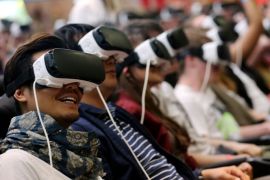 Visitors try out a 4-D rollercoaster ride with the Samsung Gear VR goggles at the Gamescom gaming convention in Cologne, Germany, 18 August 2016. The Gamescom gaming convention runs from 17 to 21 August 2016.