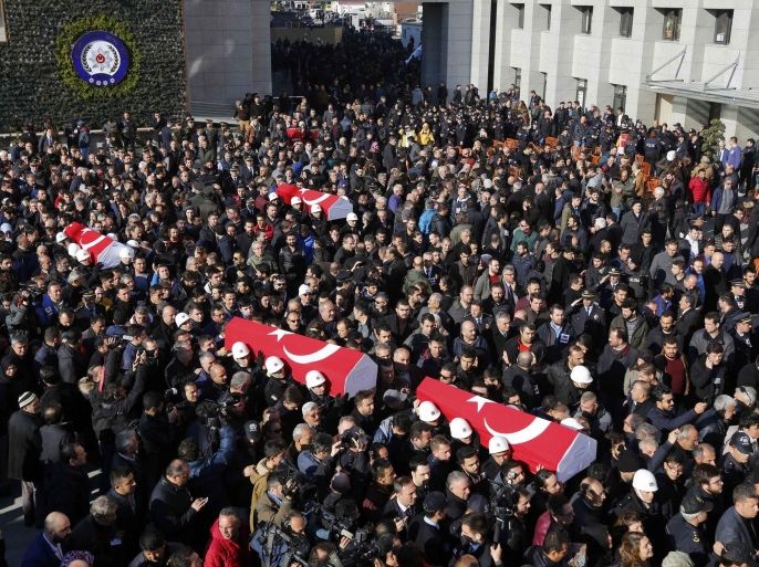 People carry the flag-draped coffins of police officers killed in Saturday's blasts in Istanbul, Turkey, December 11, 2016. REUTERS/Murad Sezer