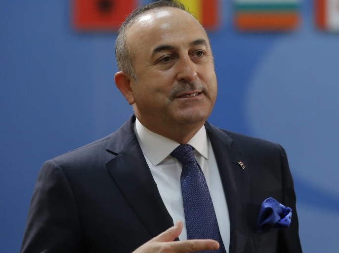 Turkish Foreign Minister Mevlut Cavusoglu (L) prepares for the start of a council meeting of the Foreign affairs ministers of the North Atlantic Treaty Organization (NATO) at the alliance's headquarters in Brussels, Belgium, 06 December 2016. Nato ministers are scheduled to discuss the strategy of the alliance with Sweden and Finland.