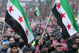 Demonstrators hold Syrian flags at a demonstration called 'Stand up for Aleppo' in the city centre of Hamburg, Germany, 17 December 2016. Hundreds of people protested against the war in Syria.