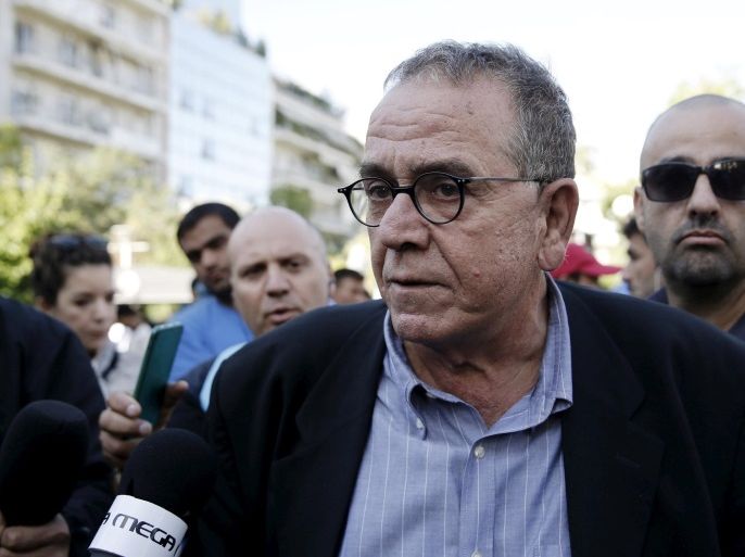 FILE PHOTO: Greek Migration Minister Yannis Mouzalas talks to the media at central Athens's Victoria Square, where many refugees and migrants had set up following their arrival in Athens, Greece, October 1, 2015. REUTERS/Alkis Konstantinidis/File Photo