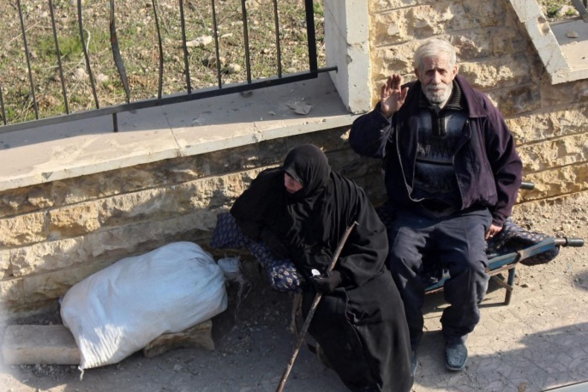 An elderly couple waves at Syrian soldiers in Aleppo, Syria, 12 December 2016. The army recaptured the neighborhood on 12 December 2016 following clashes with rebels. According to media reports, the army is now holding on 99 percent of Aleppo’s eastern neighborhoods.