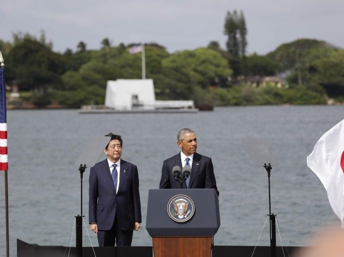 US President Barack Obama (R) and Japanese Prime Minister Shinzo Abe (L) hold a joint press conference following their visit to the USS Arizona Memorial (in background) in Pearl Harbor in Honolulu, Hawaii, USA, 27 December 2016, 75 years after Japan's attack on Hawaii in 1941. Abe is the first Japanese prime minister to visit the Arizona Memorial and the fourth to visit Pear Harbor after World War II.
