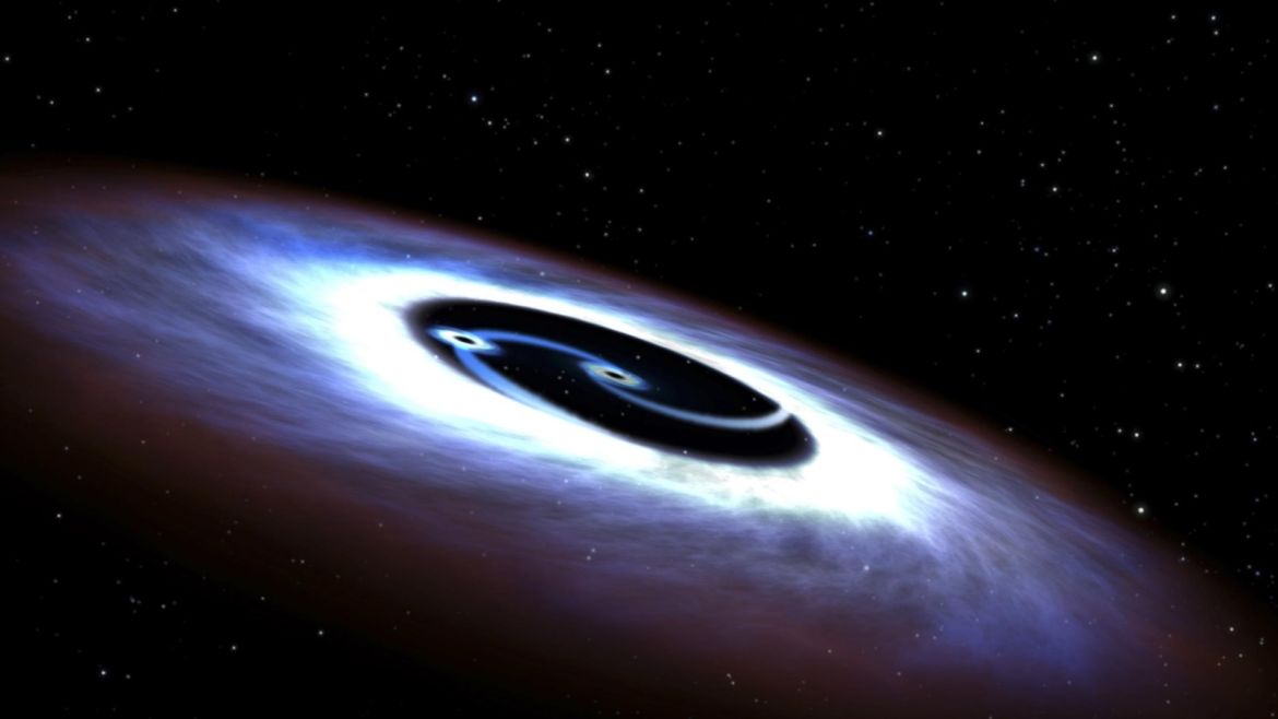 Markarian 231, a binary black hole found in the center of the nearest quasar host galaxy to Earth, is seen in a NASA illustration released August 27, 2015.  Like a pair of whirling skaters, the black-hole duo generates tremendous amounts of energy that makes the core of the host galaxy outshine the glow of the galaxy's population of billions of stars, according to a NASA news release. Hubble observations of the ultraviolet light emitted from the nucleus of the galaxy w