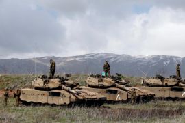 Israeli soldiers stand atop tanks in the Golan Heights near Israel's border with Syria March 19, 2014. REUTERS/Ronen Zvulun/File Photo