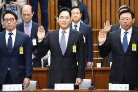 (L-R) SK Group chairman Chey Tae-Won, Samsung Group's heir-apparent Lee Jae-yong and Lotte Group Chairman Shin Dong-Bin take an oath during a parliamentary probe into a scandal engulfing President Park Geun-Hye at the National Assembly in Seoul on December 6, 2016. The publicity-shy heads of South Korea's largest conglomerates faced their worst nightmare on December 6, as they were publicly grilled about possible corrupt practises before an audience of millions. REUTE