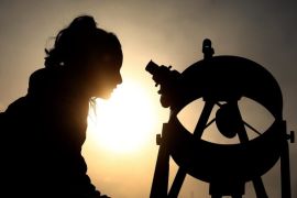 epaselect epa05598701 A woman looks through a solar telescope during an astronomical observation at the Chilean Skies Observatory, in Santiago de Chile, Chile, 22 October 2016. Thirty people participated in a daytime astronomical observation with a dozen telescopes that allowed them to see the sun, planets such as Venus, Mars and Saturn and some stars.