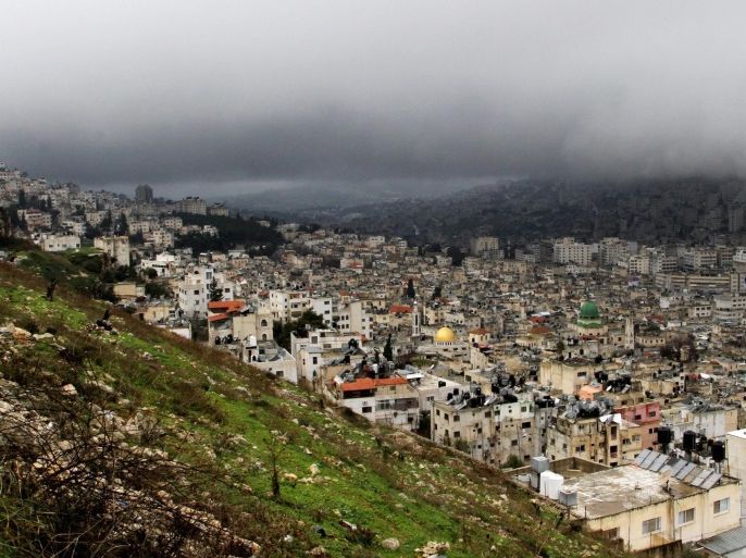 General view as low clouds hang over the city of Nablus, West Bank, 08 January 2015. Israelis and Palestinians along the coastline of the Mediterranean Sea and in Jerusalem are bracing themselves for incoming winter storm with strong winds and snowfalls in higher altitudes as many Middle Eastern countries experience extreme weather conditions.