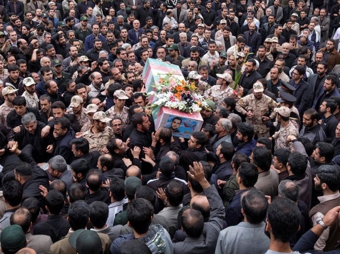 Mourners carry the coffin of Amin Karimi, a member of Iranian Revolutionary Guards who was killed in Syria, during his funeral in Tehran October 28, 2015. REUTERS/Raheb Homavandi/TIMA/File Photo ATTENTION EDITORS - THIS IMAGE WAS PROVIDED BY A THIRD PARTY. FOR EDITORIAL USE ONLY.