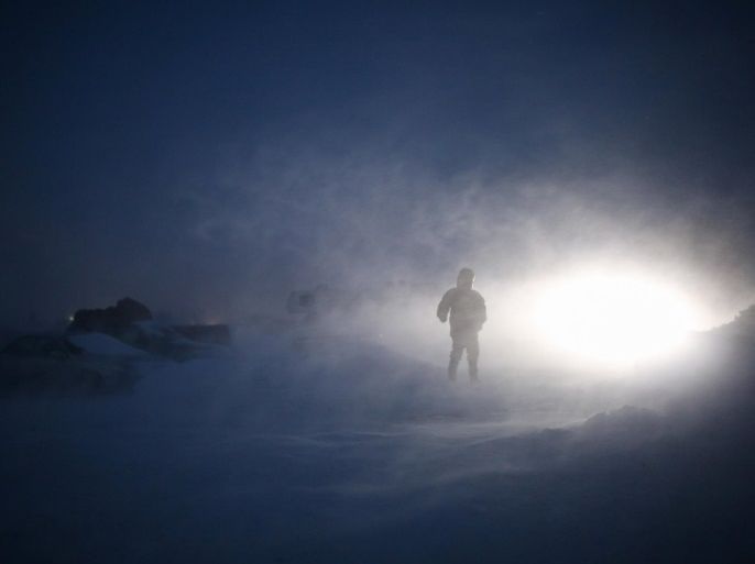 A man walks down a path during dusk in the Rosebud camp where "water protectors" continue to demonstrate against plans to pass the Dakota Access pipeline adjacent to the Standing Rock Indian Reservation, near Cannon Ball, North Dakota, U.S., December 7, 2016. Picture taken December 7, 2016. REUTERS/Stephen Yang