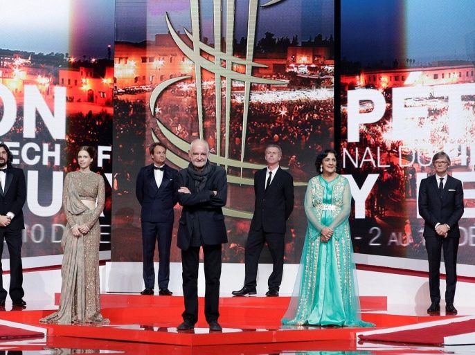 Jury members arrive on stage during the opening ceremony of the 16th Marrakech International Film Festival in Marrakesh, December 2, 2016.(L-R) Canadien Actress Suzanne Clement, Argentinian Director Lisandro Alonso, Indian actress Kalki Koechlin, Australian Actor Jason Clarke, Director and Jury President Bela Tarr, French Director Bruno Dumont, Moroccan Fatima Harandi, Director Bille August and Italian Actress Yasmine Trinca. REUTERS/Youssef Boudlal